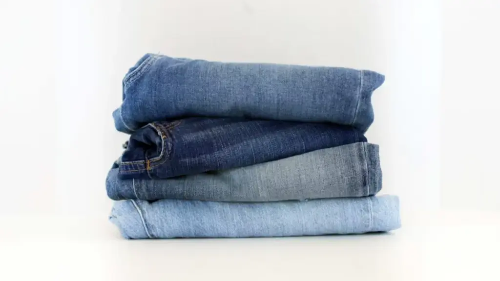 a stack of jeans sitting on top of each other