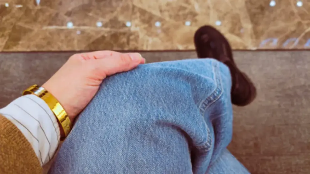 a woman in light wash denim jean