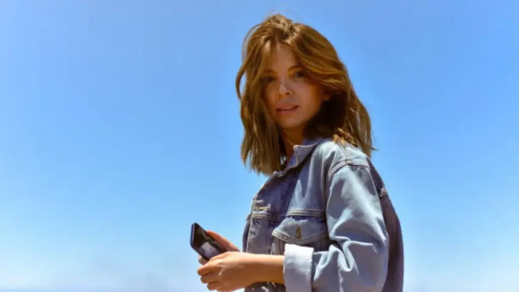 a girl in denim jacket