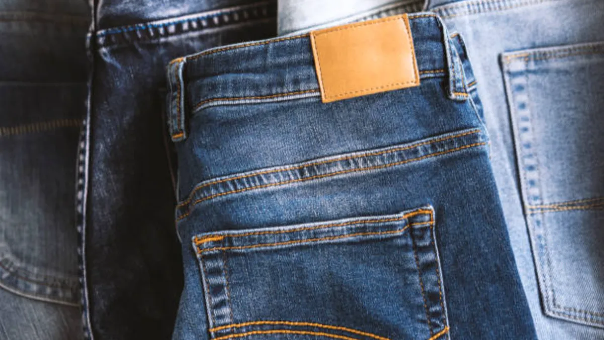 private label denim jeans on the desk