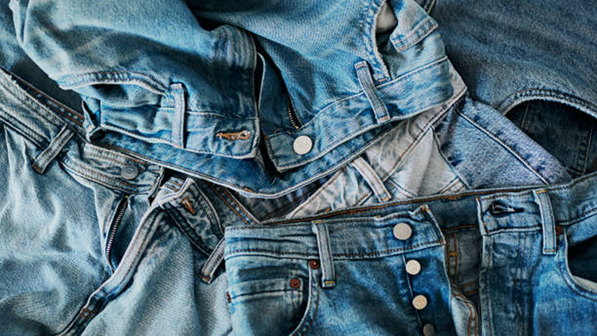 A pile of light blue denim jeans